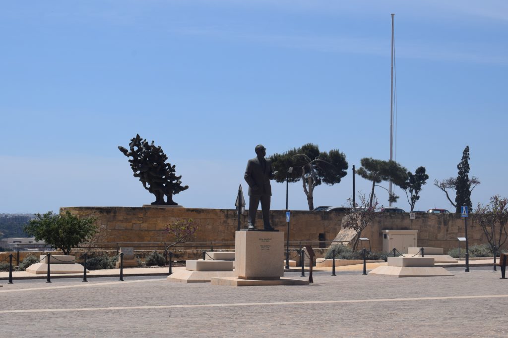 Monument to Dom Mintoff. Note the modern capstones marking position of some of the granaries.